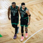 Jaylen Brown puts his arm around Jayson Tatum during the 2024 NBA Finals.
