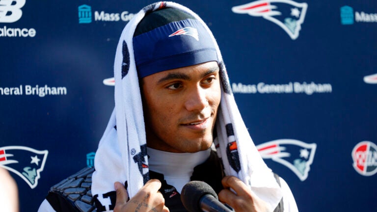 New England Patriots cornerback Christian Gonzalez speaks to reporters after practice at Gillette Stadium on Aug. 25, 2026, in Foxborough.