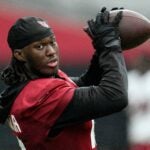 Arizona Cardinals wide receiver Marvin Harrison Jr. makes a catch during NFL football training camp, Sunday, July 26, 2026, in Glendale, Ariz.