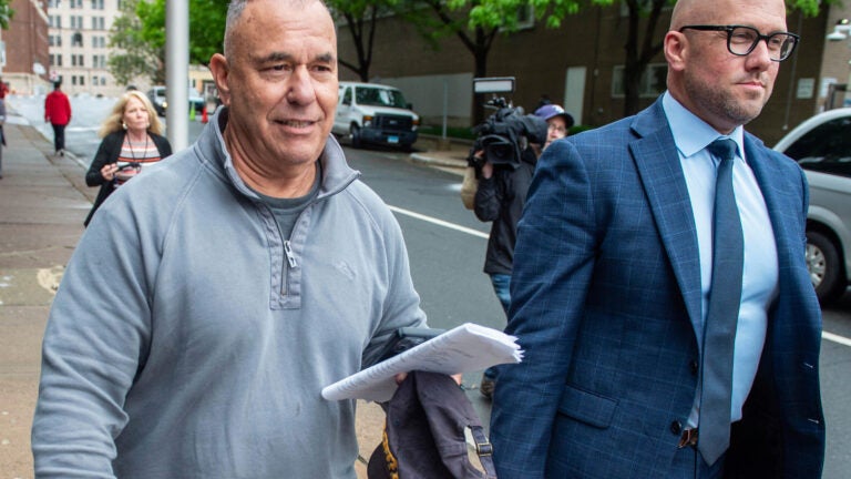 FILE - Former Connecticut deputy budget director Konstantinos "Kosta" Diamantis, left, accompanied by his lawyer Vincent Provenzano, right, walks out of federal court on May 16, 2024, in Hartford, Conn. (Aaron Flaum/Hartford Courant via AP, File) AP