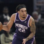 Sacramento Kings guard Devin Carter moves the ball during the first half of an NBA basketball game against the Golden State Warriors, Tuesday, April 7, 2026, in San Francisco.