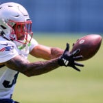 New England Patriots running back TreVeyon Henderson catches a pass during an NFL football practice, Thursday, June 11, 2026, in Foxborough, Mass. (AP Photo/