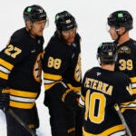Boston Bruins right wing David Pastrnak (88) talks to teammates before a power-play against the Philadelphia Flyers during the third period at TD Garden on Sept. 22, 2026, in Boston.