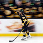 Boston Bruins right wing David Pastrnak (88) skates along the bench after assisting in a goal during the third period at TD Garden on Sept. 22, 2026, in Boston.