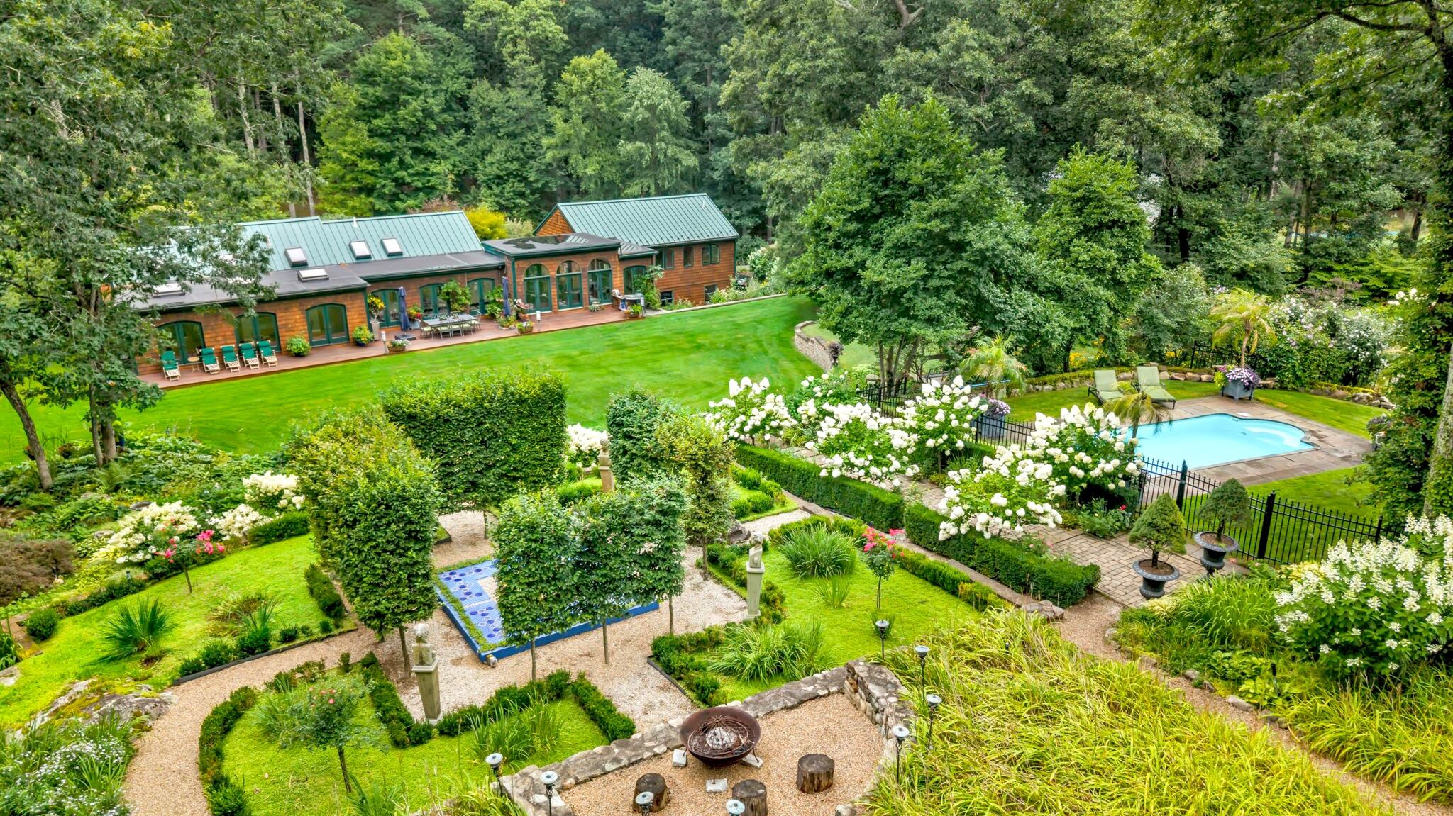 boston.com - Daisy Levine - This Sudbury home's formal gardens boast global inspiration and 25+ years of memories