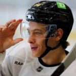 The Boston Bruins held training camp at Warrior Ice Arena. James Hagens takes a breather between drills.