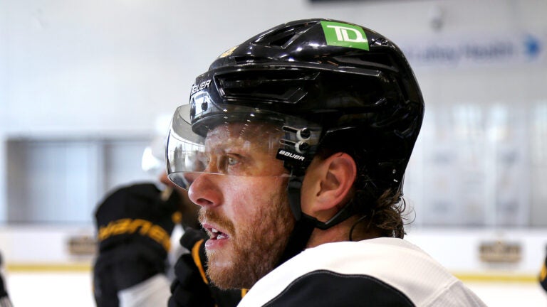 The Boston Bruins held training camp at Warrior Ice Arena. David Pastrnak takes a breather.