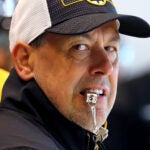 The Boston Bruins held training camp at Warrior Ice Arena. Coach Marco Sturm looks over his players during a drill.