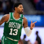 Boston Celtics forward Paul George (13) points after hitting a shot against the Detroit Pistons in the second half of an NBA basketball game in Detroit, Tuesday, Oct. 20, 2026.