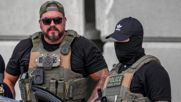 ICE officers stand at the scene where a man was shot in his vehicle by an ICE officer, Sunday, Sept. 20, 2026, in Austin, Texas. Aaron E. Martinez /Austin American-Statesman via AP