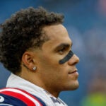New England Patriots cornerback Christian Gonzalez (0) reacts after defeating the Pittsburgh Steelers in an NFL football game in Foxborough, Mass., Sunday, Sept. 20, 2026.